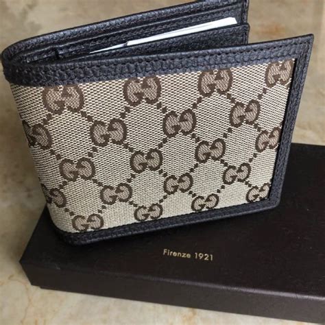 gucci wallet with metal insignia|real Gucci men's wallet.